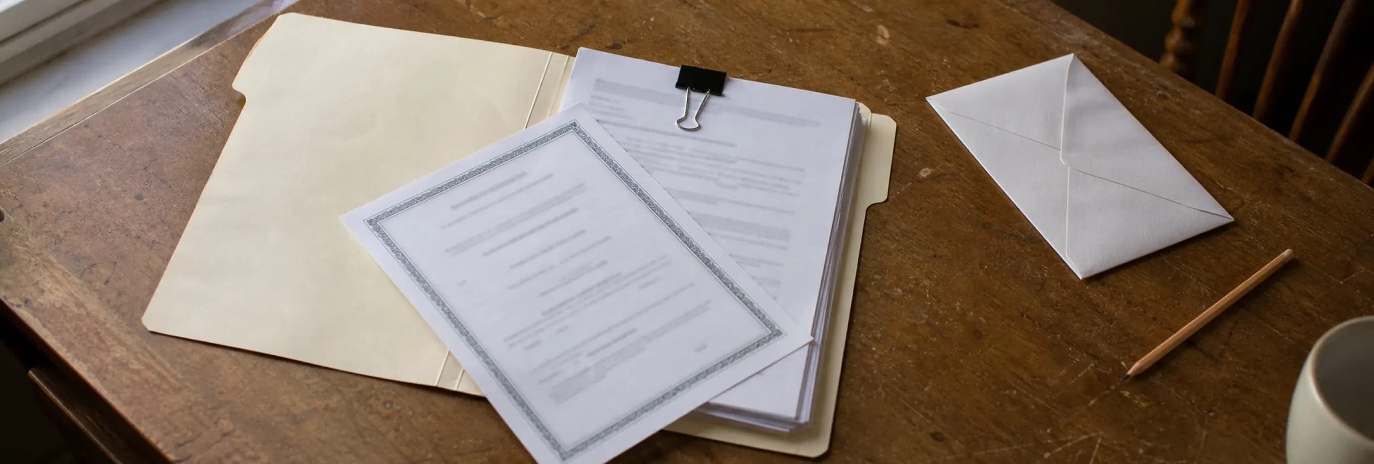 A certificate still sitting in a folder of finished paperwork